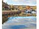 Charming waterfront scene with colorful buildings reflected in the calm water and docked boats at 9 Rue Grimaldi Way, Henderson, NV 89011