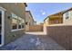 Backyard featuring gravel and partial block wall between houses at 9086 Nostrand Ave, Las Vegas, NV 89148