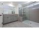 Modern bathroom featuring a double sink vanity and a frameless glass shower at 9086 Nostrand Ave, Las Vegas, NV 89148