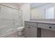 Bathroom featuring a shower over tub, toilet and sink with vanity and granite countertop at 9086 Nostrand Ave, Las Vegas, NV 89148