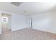 Spacious, carpeted bedroom with neutral walls and natural light from a window at 9086 Nostrand Ave, Las Vegas, NV 89148