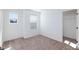 Bedroom with neutral walls and carpet with a window for natural light and view into the closet at 9086 Nostrand Ave, Las Vegas, NV 89148