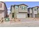 Two-story home featuring a two-car garage, neutral paint and minimal landscaping at 9086 Nostrand Ave, Las Vegas, NV 89148