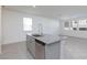 The modern kitchen boasts a granite island, stainless steel dishwasher, and large sink at 9086 Nostrand Ave, Las Vegas, NV 89148