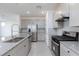 Well-equipped kitchen with stainless steel appliances, ample storage, and granite countertops at 9086 Nostrand Ave, Las Vegas, NV 89148
