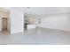 Open living room with kitchen, tile floors, and neutral paint enhance the bright, airy feel at 9086 Nostrand Ave, Las Vegas, NV 89148