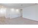 Neutral carpeted loft with white walls and natural light from a window at 9086 Nostrand Ave, Las Vegas, NV 89148