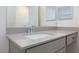 Close-up of a bathroom vanity with gray countertop and modern chrome faucet at 9086 Nostrand Ave, Las Vegas, NV 89148