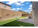 Relax in your private backyard with lush artificial turf and a charming brick patio area at 9190 Wine Cellar Ave, Las Vegas, NV 89148