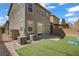 Low maintenance backyard with artificial turf and brick pavers offers space for outdoor entertaining at 9190 Wine Cellar Ave, Las Vegas, NV 89148
