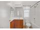 Clean bathroom with vanity, decorative mirror, and combined shower and tub at 9190 Wine Cellar Ave, Las Vegas, NV 89148