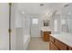 Bathroom with glass shower, tub, and dual sink vanity with a view to closet at 9190 Wine Cellar Ave, Las Vegas, NV 89148