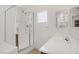 Clean bathroom features a glass shower, a white sink, and a mirror at 9190 Wine Cellar Ave, Las Vegas, NV 89148