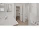 Bathroom with separate vanities, soaking tub, shower, and walk-in closet access at 9190 Wine Cellar Ave, Las Vegas, NV 89148