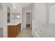 Bright bathroom boasts a soaking tub, dual sinks with vanities, and a walk-in closet at 9190 Wine Cellar Ave, Las Vegas, NV 89148
