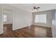 Bright bedroom with hardwood floors, a ceiling fan, and ample natural light at 9190 Wine Cellar Ave, Las Vegas, NV 89148