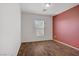 Bedroom boasting neutral paint and durable dark hardwood flooring at 9190 Wine Cellar Ave, Las Vegas, NV 89148