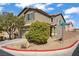 Street corner view of a well-manicured two-story home with neutral colors at 9190 Wine Cellar Ave, Las Vegas, NV 89148