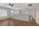 Open loft area with hardwood floors, neutral walls, and large windows offering ample natural light at 9190 Wine Cellar Ave, Las Vegas, NV 89148