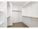 Walk-in closet with built-in shelving and ample storage, providing organization and convenience at 9190 Wine Cellar Ave, Las Vegas, NV 89148