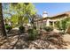 The backyard has desert landscaping, mature trees, and is perfect for enjoying outdoor living and entertaining at 9329 January Dr, Las Vegas, NV 89134
