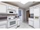 Close up view of the kitchen with tile flooring and white cabinets at 9329 January Dr, Las Vegas, NV 89134