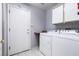 Laundry room with washer, dryer, and storage cabinets at 9329 January Dr, Las Vegas, NV 89134