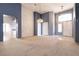 Inviting living room with open floor plan, featuring tile floors and a vaulted ceiling at 9329 January Dr, Las Vegas, NV 89134