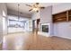 Spacious living room with high ceilings, fireplace, and an open concept to the kitchen at 9329 January Dr, Las Vegas, NV 89134
