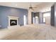 Large living room featuring a fireplace and ample natural light at 9329 January Dr, Las Vegas, NV 89134