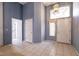 Open-concept living room with tile flooring and neutral wall paint with ample natural light at 9329 January Dr, Las Vegas, NV 89134