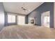 Bright living room features vaulted ceilings, a fireplace, and sliding glass doors to a patio at 9329 January Dr, Las Vegas, NV 89134