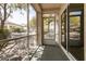 Screened in patio with view of backyard landscaping and mature trees at 9329 January Dr, Las Vegas, NV 89134