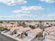 An aerial view showcases a neighborhood of well-maintained homes with desert landscaping at 9333 Jumpin Juniper Ave, Las Vegas, NV 89129