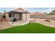 This backyard is perfect for relaxing with its covered patio and low maintenance landscaping at 9333 Jumpin Juniper Ave, Las Vegas, NV 89129