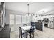 Bright dining room with a stylish table setting, adjacent to the well-equipped kitchen at 9333 Jumpin Juniper Ave, Las Vegas, NV 89129