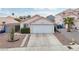 Charming single-story home with a well-maintained front yard and a convenient two-car garage at 9333 Jumpin Juniper Ave, Las Vegas, NV 89129