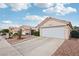 Attractive home with tidy landscaping, desert rock accents, and a two-car garage at 9333 Jumpin Juniper Ave, Las Vegas, NV 89129