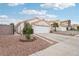 Well-maintained home with desert landscaping and a spacious driveway leading to the garage at 9333 Jumpin Juniper Ave, Las Vegas, NV 89129