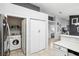 Laundry area features a washer, dryer, storage, and neutral paint palette at 9333 Jumpin Juniper Ave, Las Vegas, NV 89129