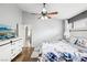 Main bedroom features a ceiling fan, ensuite bath, and dresser at 9333 Jumpin Juniper Ave, Las Vegas, NV 89129