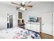 Main bedroom featuring ceiling fan, ensuite bath, and sliding door dresser at 9333 Jumpin Juniper Ave, Las Vegas, NV 89129