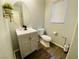 Charming half bath featuring a modern vanity with an oval mirror and a window at 11117 Okeefe Ct, Las Vegas, NV 89144