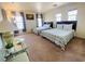 Sunlit bedroom showcasing two beds with coordinated bedding, large windows, and carpet at 11117 Okeefe Ct, Las Vegas, NV 89144