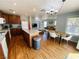 Open-concept kitchen with hardwood floors, an island, modern appliances, and ample counter space at 11117 Okeefe Ct, Las Vegas, NV 89144