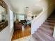 Inviting living room has hardwood floors, stairs, large windows and comfortable seating at 11117 Okeefe Ct, Las Vegas, NV 89144