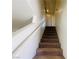 Carpeted staircase with white walls and railing leading to the upper level at 11117 Okeefe Ct, Las Vegas, NV 89144