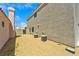 Side yard with low-maintenance landscaping, block wall, and view of an exterior elevation at 1312 Pacific Terrace Dr, Las Vegas, NV 89128
