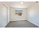 A small bedroom with sliding closet doors and carpeted floors at 1312 Pacific Terrace Dr, Las Vegas, NV 89128