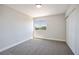 Bedroom with neutral carpet, white baseboards, a window, and closet at 1312 Pacific Terrace Dr, Las Vegas, NV 89128